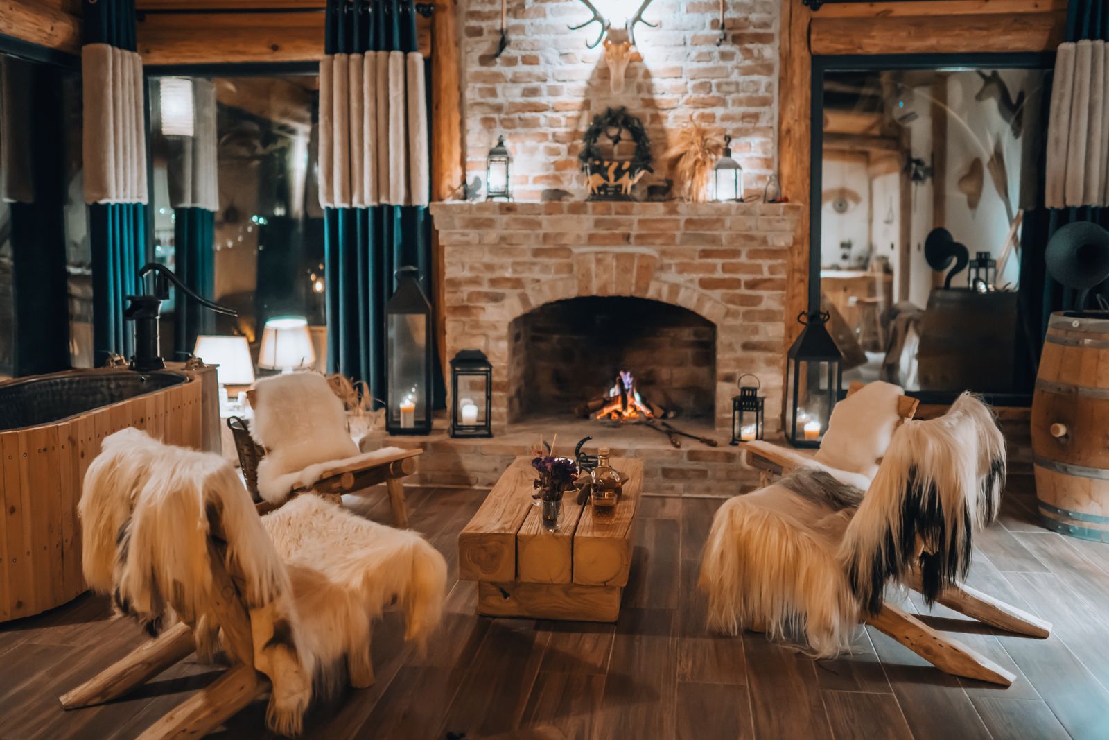Rustic living room with a fire and fur throws