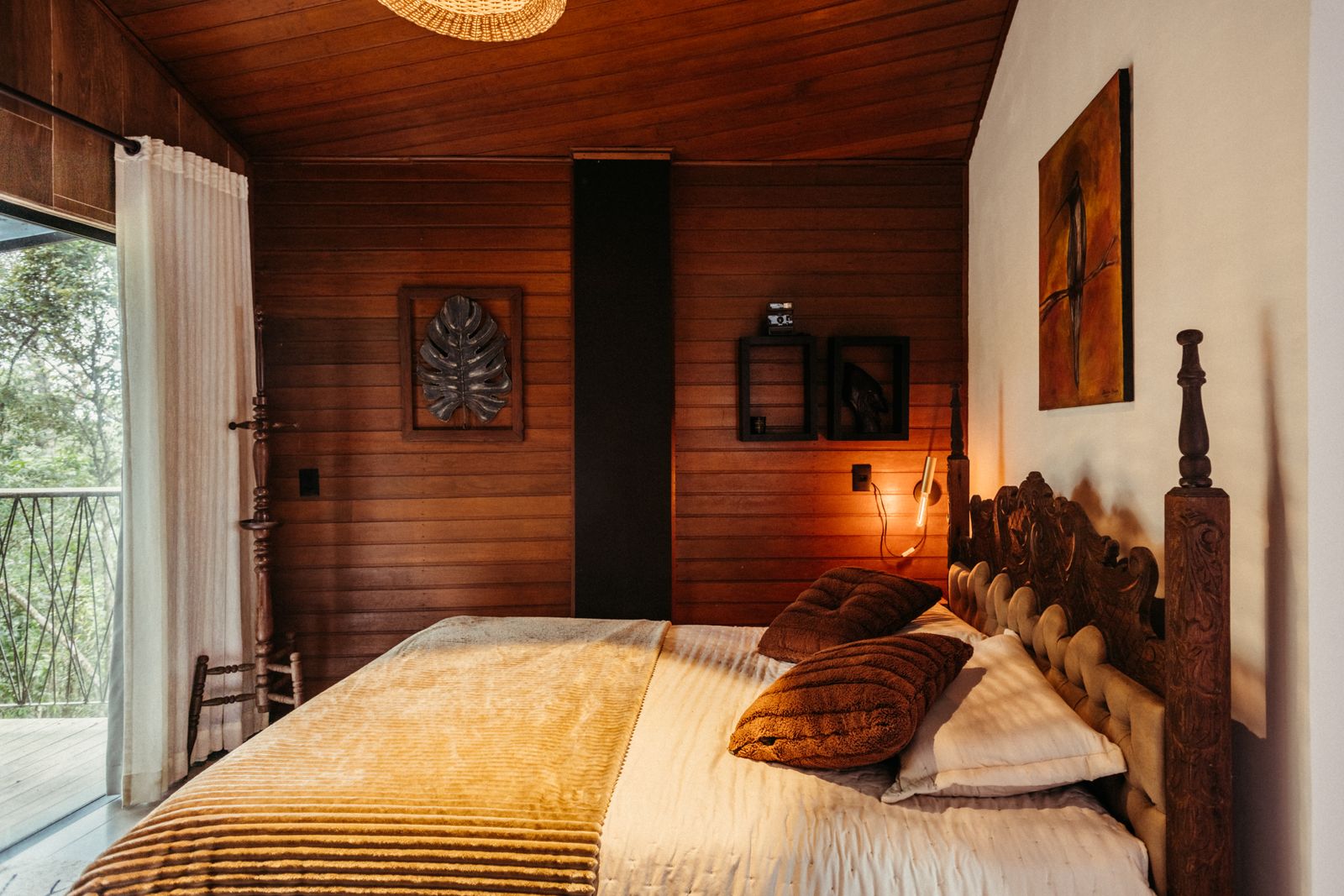 Warm wooden bedroom interior at Pinecrest Mountain Lodge