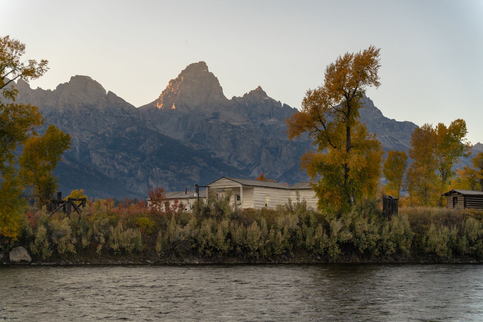Autumn on the river, cabin in the trees