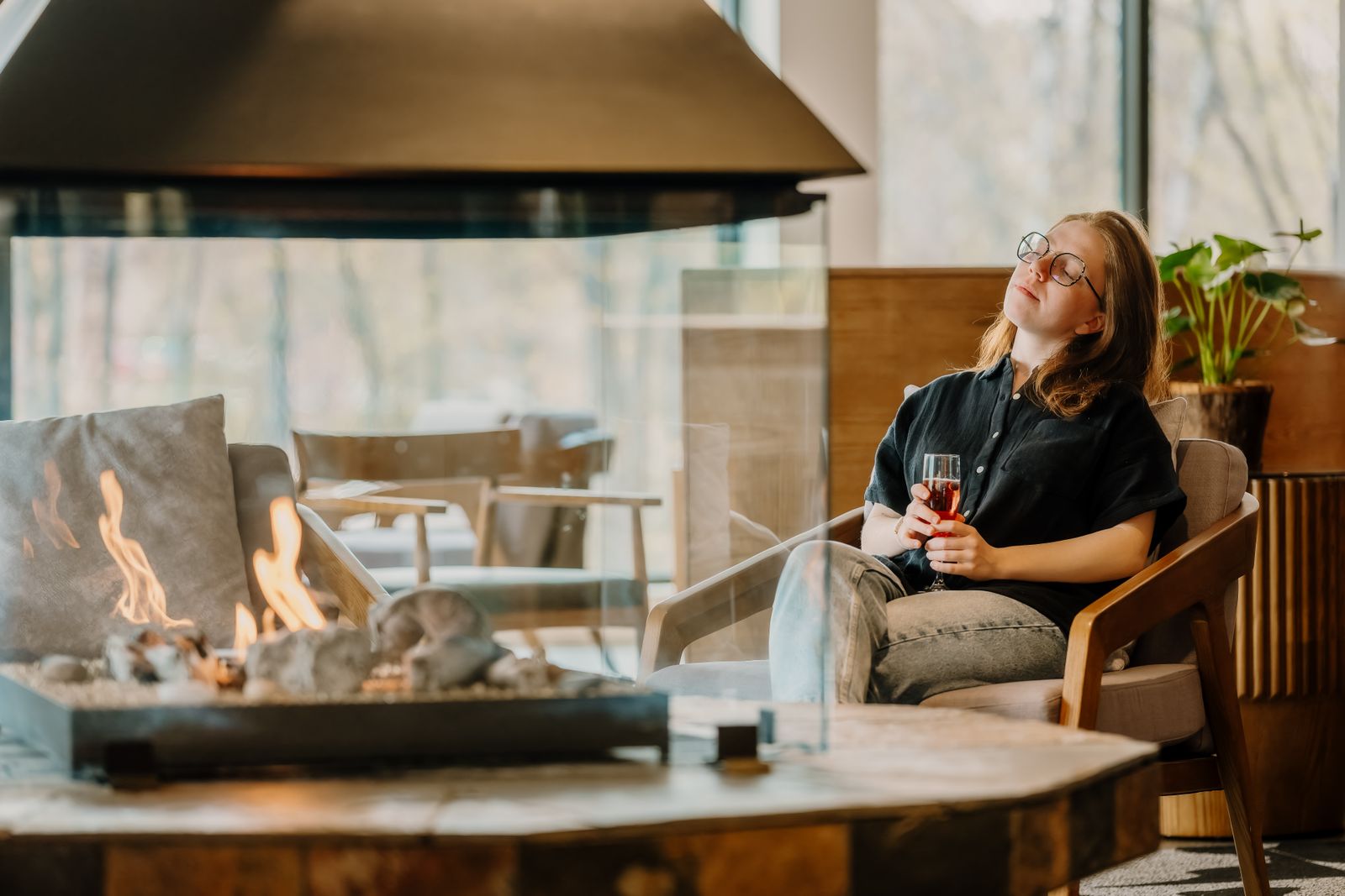 A quiet moment with a drink beside the fire