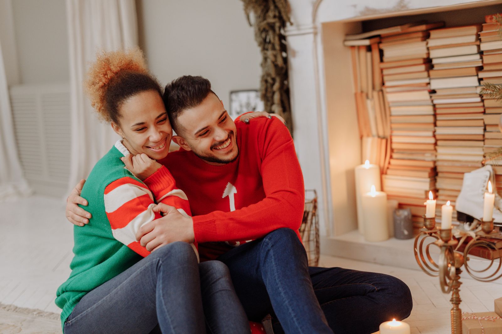 A couple by a fireplace in winter