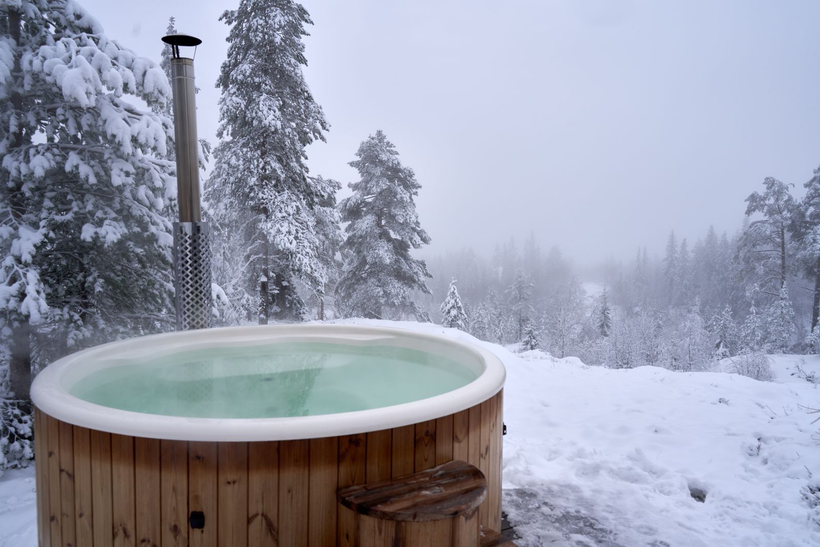 Steaming outdoor hot spring pool in the snow